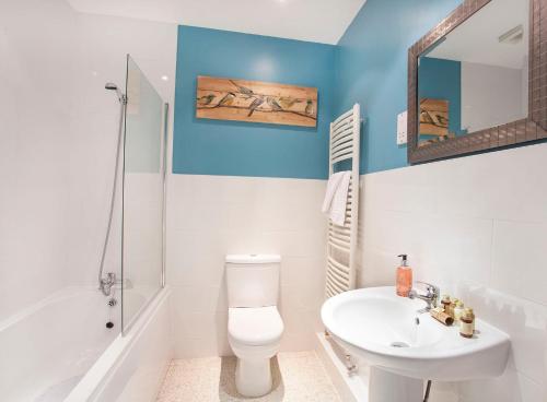 a bathroom with a white toilet and a sink at Thomas, Off Leeman Road in York