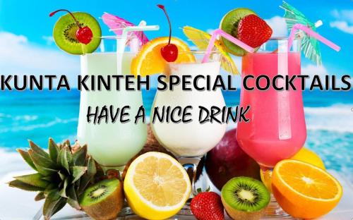a group of drinks with fruit on a table at Kunta Kinteh Beach Complex in Kotu