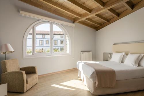 Postel nebo postele na pokoji v ubytování Hotel Nagusi