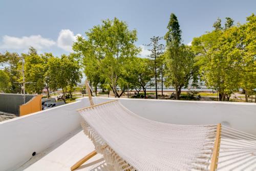 a hammock on the roof of a building at Casa do Chico in Olhão