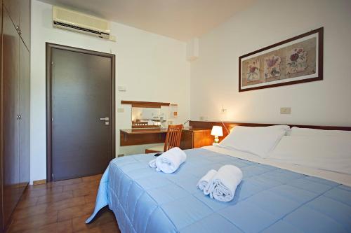 Postel nebo postele na pokoji v ubytování Albergo Romagna