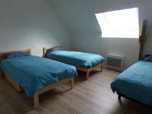 מיטה או מיטות בחדר ב-LES REINETTES - Les Vergers de Guerlédan