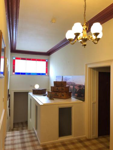 a room with a counter with boxes on it at The Purple Tree Guest House in Torquay