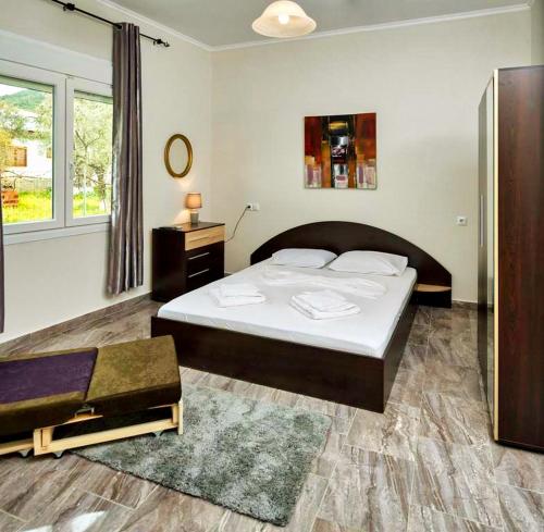 Postel nebo postele na pokoji v ubytování Cristi Apartments