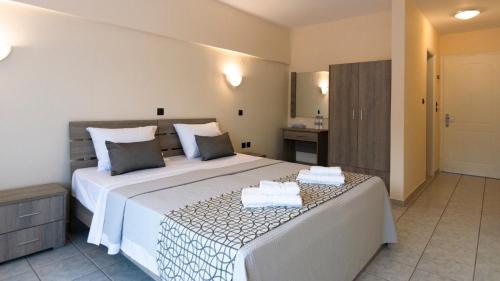 Postel nebo postele na pokoji v ubytování Pravi Hotel