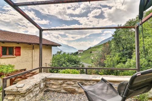 a view from the balcony of a house at Renovated historic barn in mountain village in Ollon