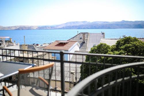 a view of the water from the balcony of a building at Apartments ANA Karlobag in Karlobag