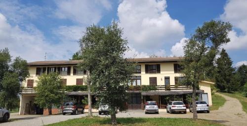 a building with cars parked in front of it at Agriturismo Cargandino in Mezzomerico