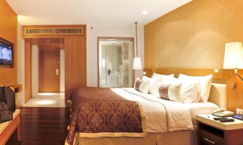 Ένα ή περισσότερα κρεβάτια σε δωμάτιο στο Hotel Bawa International