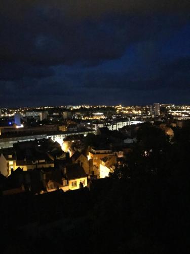 a view of a city at night at Chambre cosy dans maison de maître in Boulogne-sur-Mer