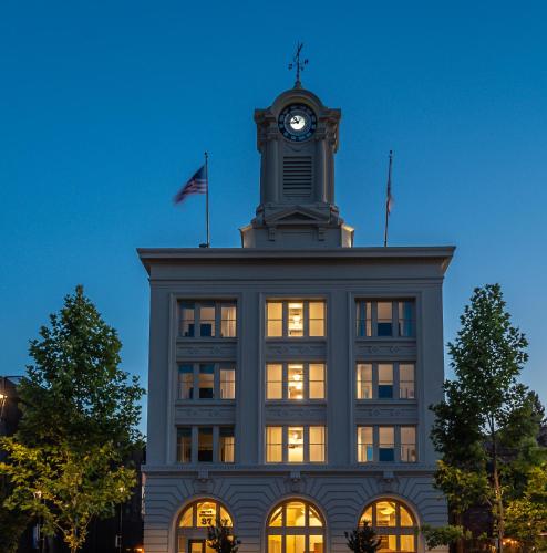 a building with a clock tower on top of it at Hotel E in Santa Rosa