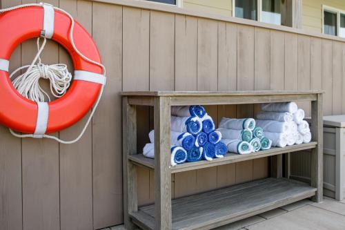 a life vest and a life preserver next to towels at Aqualina Inn Montauk in Montauk