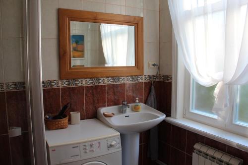 a bathroom with a sink and a mirror at Villa Florio in Jūrmala