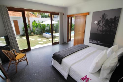 Ένα ή περισσότερα κρεβάτια σε δωμάτιο στο The Villas Umalas