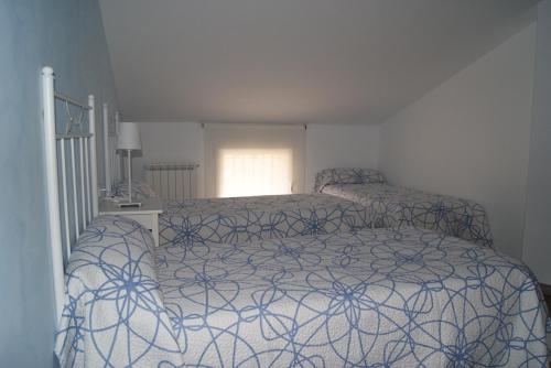 Postel nebo postele na pokoji v ubytování Apartamentos Turísticos Teruel