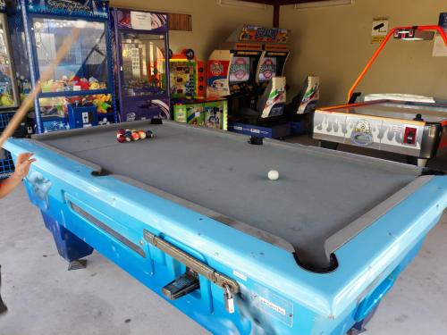 a pool table in a store with a ball on it at Gorgeous Apartment in Luxurious Noosa Resort in Noosaville
