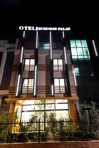 an office building with a lit up sign on it at BUSINESSPALAS DELUXE in Izmit