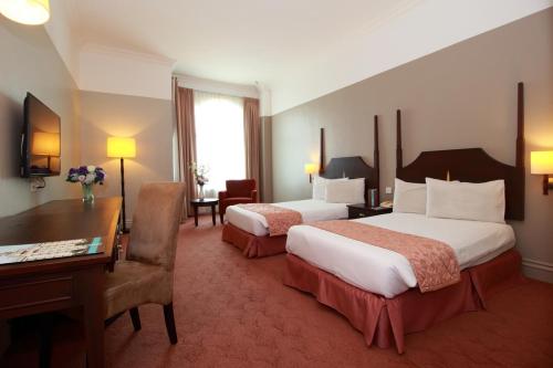Katil atau katil-katil dalam bilik di Grand Kampar Hotel