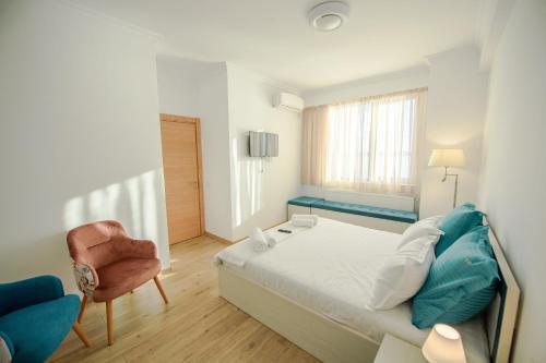 Apartament Le Bonheur tesisinde bir odada yatak veya yataklar