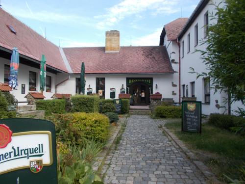 a building with a sign in front of it at Villa KONIG in Mariánské Lázně