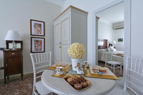 a living room with a table with food on it at SOLIDEA BNB in Salerno