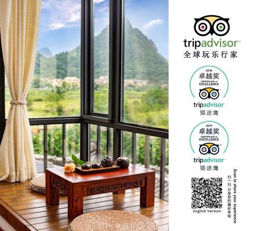 a table in front of a window with a view at Secret Courtyard Resort Hotel in Guilin