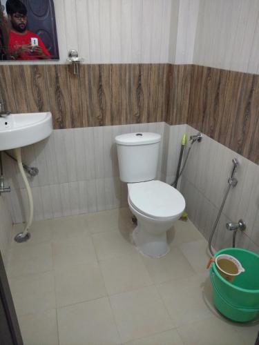 a bathroom with a toilet and a sink at Madhav Guest House in Jaipur