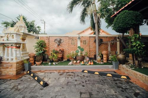 a house with a caution tape in the yard at Iyara Hua Hin Lodge in Hua Hin