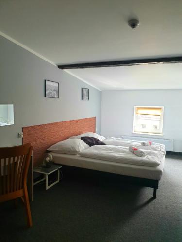 a bedroom with two beds in a room at Expolis Residence - City Center - 24h POZNAŃ GŁÓWNY #betterthanyourEX in Poznań