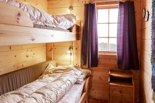 a room with two bunk beds and a window at Langlofonna in Stranda