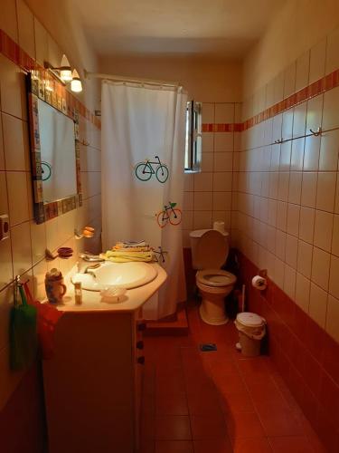 a bathroom with a sink and a toilet and a shower at Dina in Palaia Fokaia