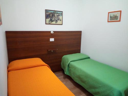 A bed or beds in a room at Casa Ferrara