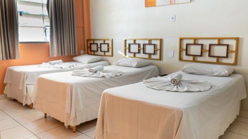 Posteľ alebo postele v izbe v ubytovaní Hotel Itaipu