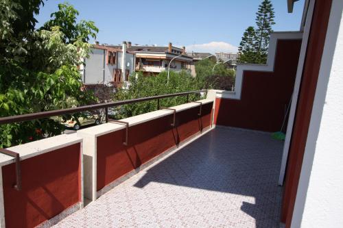 a balcony with a view of a building at Villa della Tartaruga in Casal Palocco
