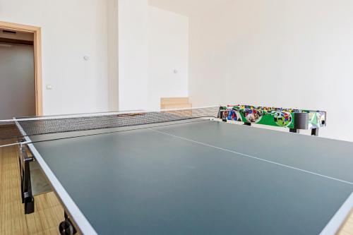a ping pong table in a room with at Thermal Hotel Seven Seasons in Banya
