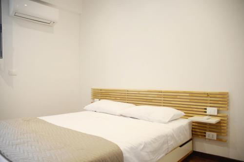 Ein Bett oder Betten in einem Zimmer der Unterkunft Il Faro Gianicolense