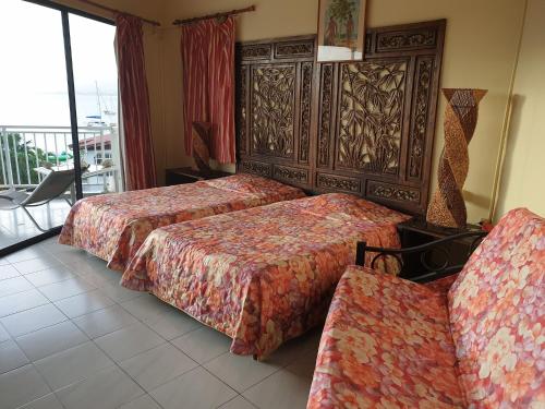 Postelja oz. postelje v sobi nastanitve Agréable Studio vue mer au Trois Îlets