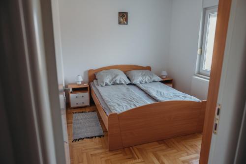 Postel nebo postele na pokoji v ubytování Apartman "JOKA"