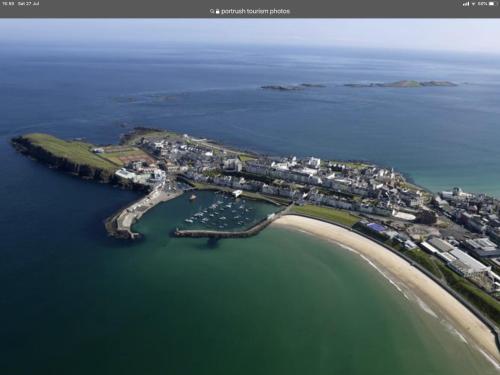 an aerial view of a small island in the water at Luxury South Pier Apartment in Portrush