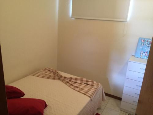 a small room with a bed and a dresser at Casa da Chapinheira in São Pedro de Alva