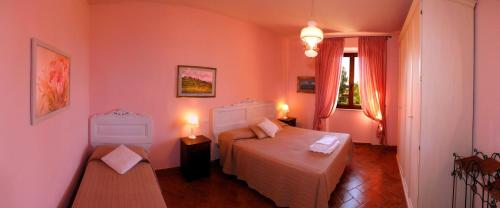 Postel nebo postele na pokoji v ubytování Agriturismo Le Pescine