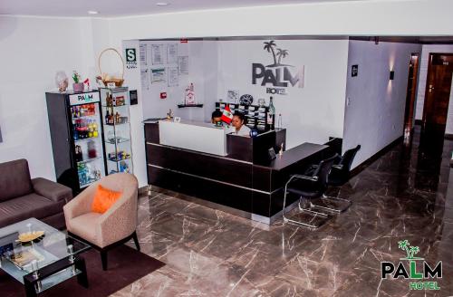 a woman behind a counter in a hair salon at Palm Hotel Tarapoto in Tarapoto