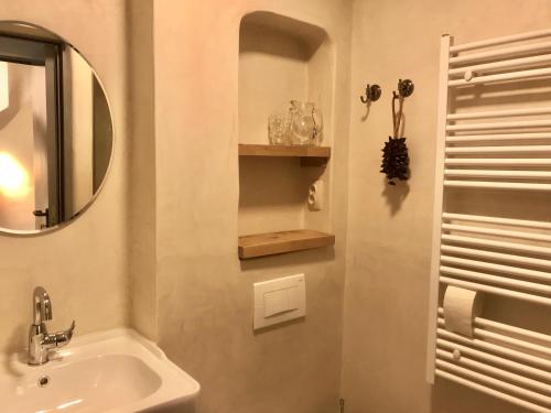 a bathroom with a sink and a mirror at The Little Room in Bovec