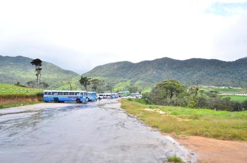 a group of buses parked on the side of a road at Yensfield Blackpool in Nuwara Eliya