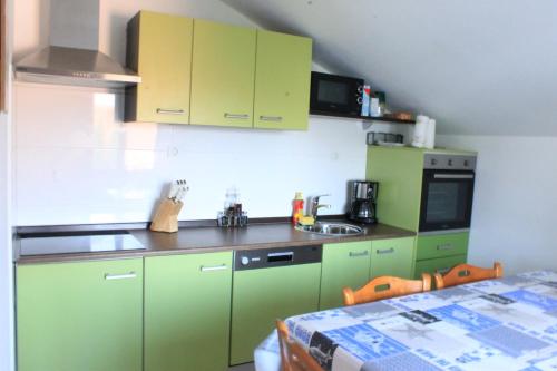 Kuchyň nebo kuchyňský kout v ubytování Apartments Jakovljevic