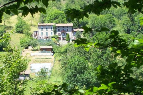 a large house in the middle of a forest at La Casina nella Valle in Serina