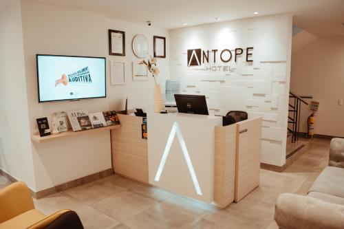 an office with a counter with a laptop on it at Antope - Apartaestudios in Cali