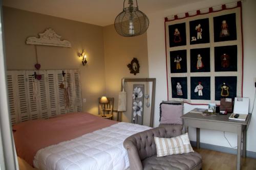 Ліжко або ліжка в номері Maison d'hôtes LE LAVOIR