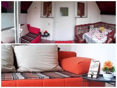 a living room with a couch and a table at Apartman Nino in Tounj