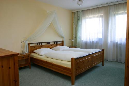 Postel nebo postele na pokoji v ubytování Gästehaus Steiger